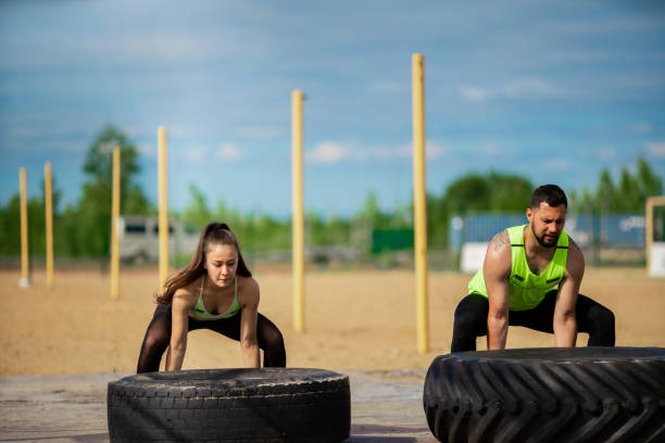 Couples doing Tyre Flip